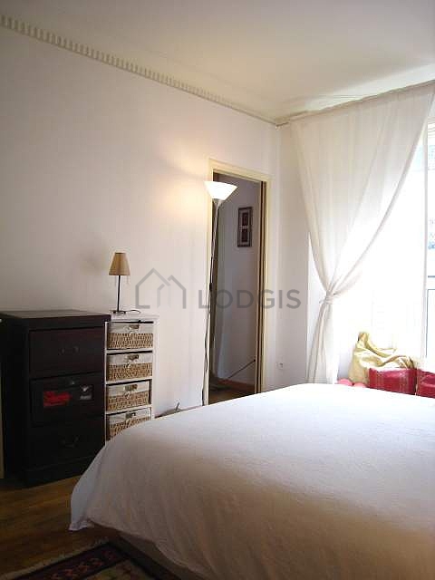 Bedroom with windows facing the road