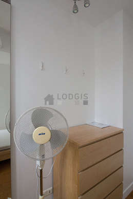 Very bright bedroom equipped with fan