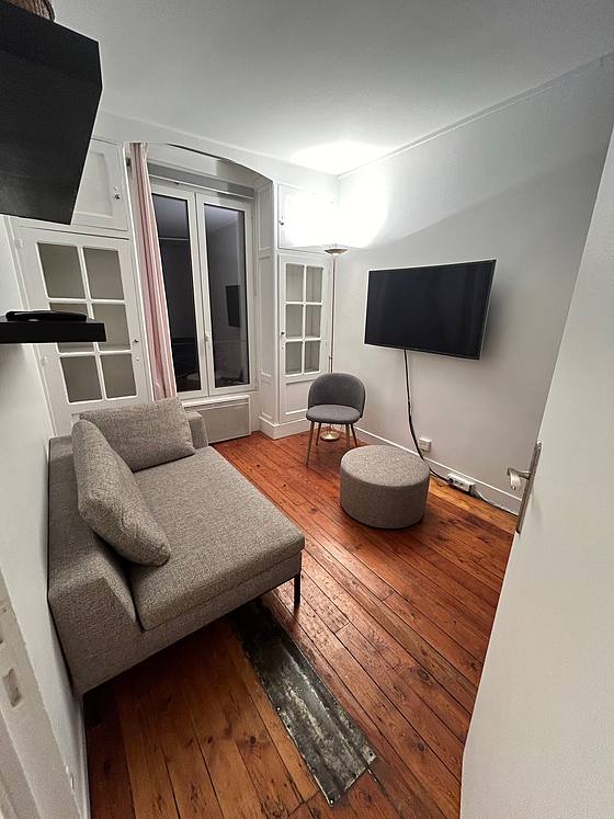 Living room with double-glazed windows facing the courtyard
