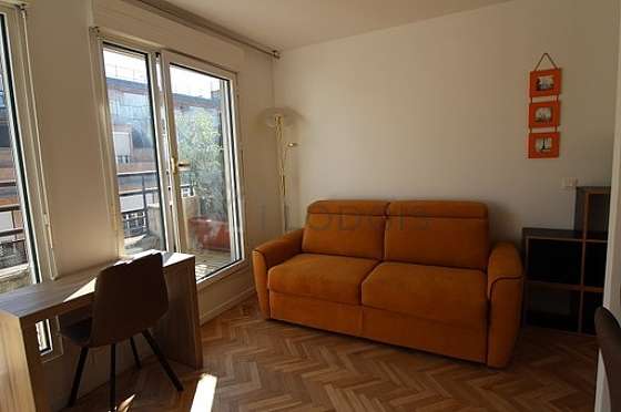 Living room furnished with 1 sofabed(s) of 140cm, tv, wardrobe, cupboard