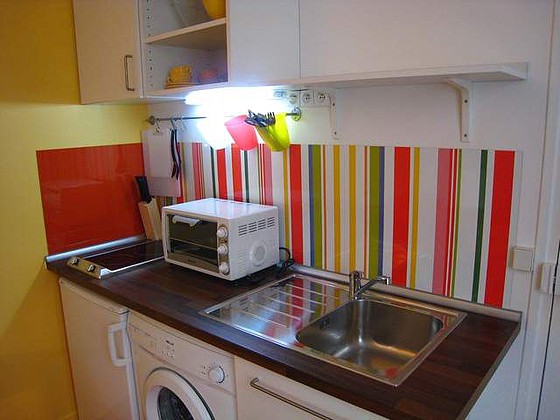 Kitchen where you can have dinner for 2 person(s) equipped with washing machine, refrigerator, freezer, crockery