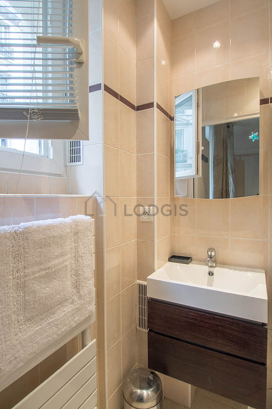 Beautiful and bright bathroom with windows and with tile floor