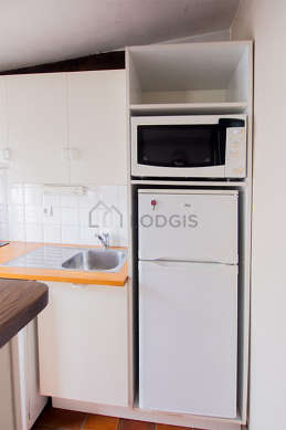 Kitchen equipped with dishwasher, hob, refrigerator, crockery