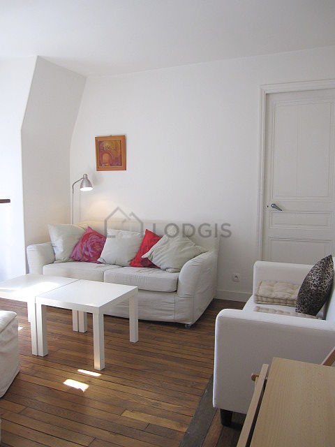 Living room with double-glazed windows facing the courtyard