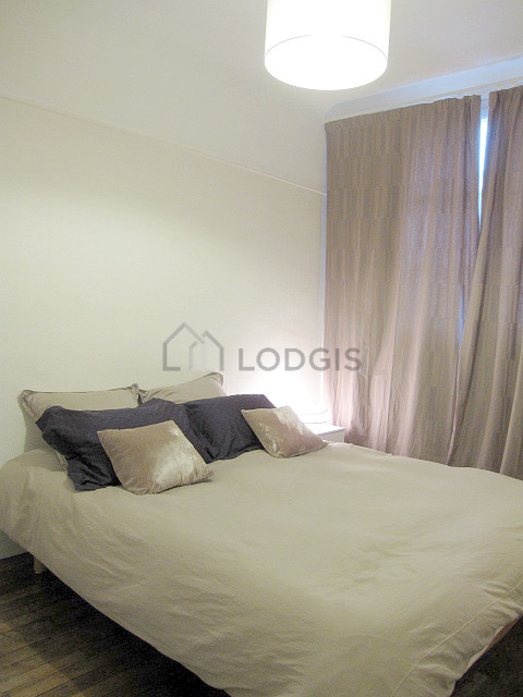 Bedroom with windows facing the road