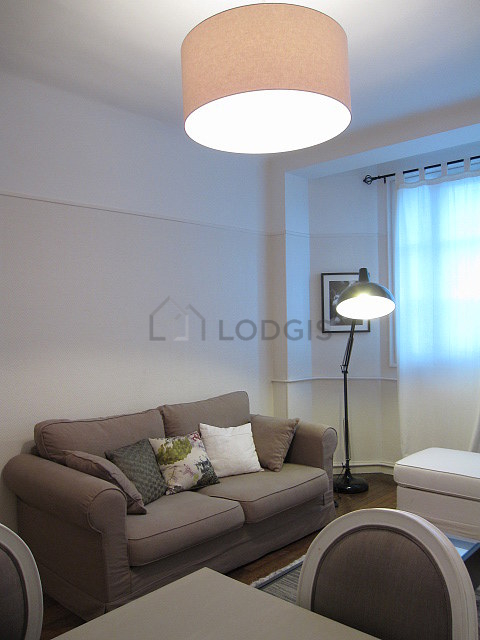 Living room with double-glazed windows facing the road