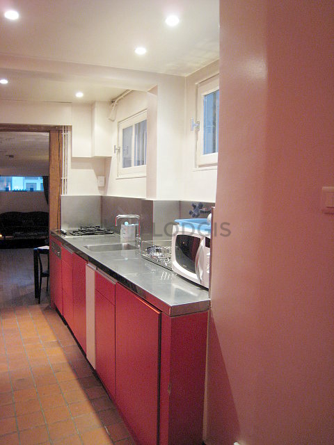 Kitchen with double-glazed windows facing the courtyard