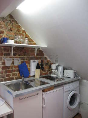 Kitchen where you can have dinner for 2 person(s) equipped with washing machine, refrigerator, freezer, crockery