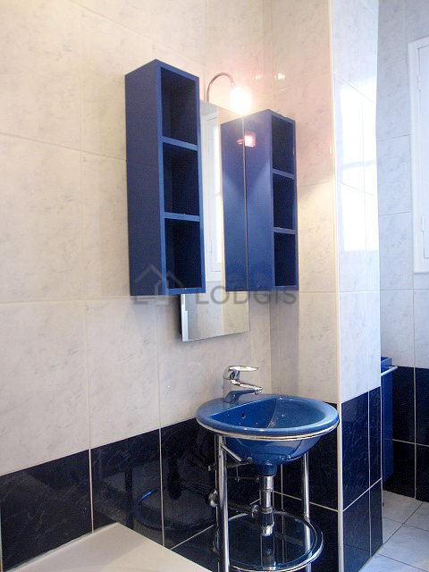 Beautiful and bright bathroom with windows and with tile floor