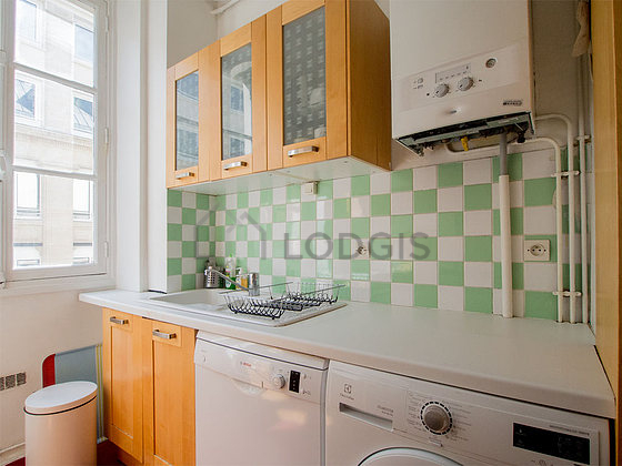 Bright kitchen with windows facing the road