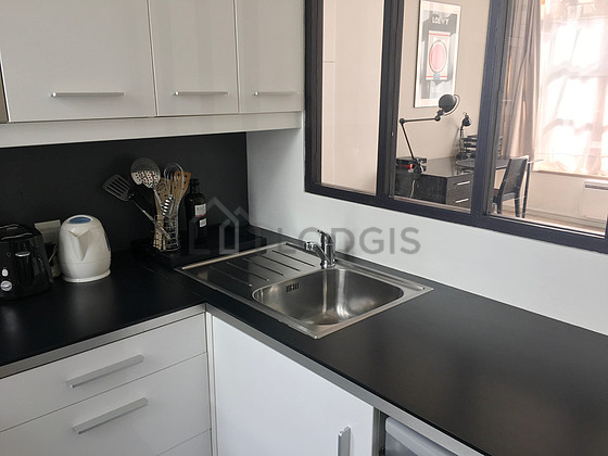 Kitchen equipped with dishwasher, hob, refrigerator, freezer