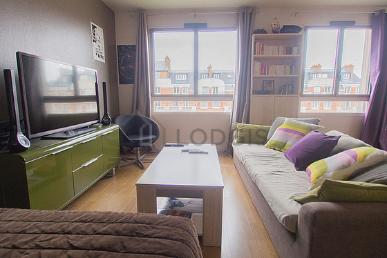 Séjour calme et très lumineux d'un appartement à Paris