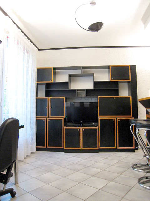 Living room with double-glazed windows facing the road