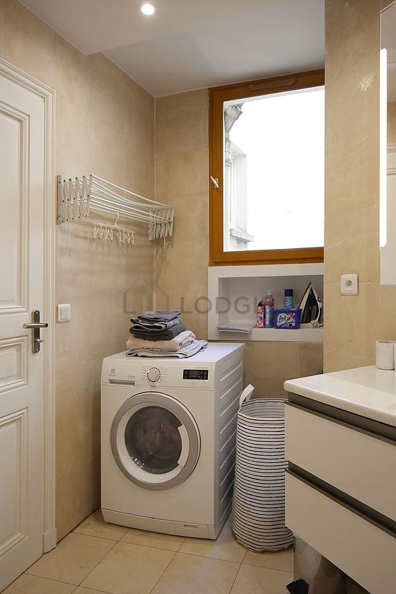 Pleasant and bright bathroom with windows and with tile floor