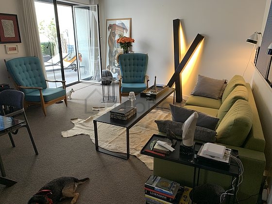 Living room with windows facing the road