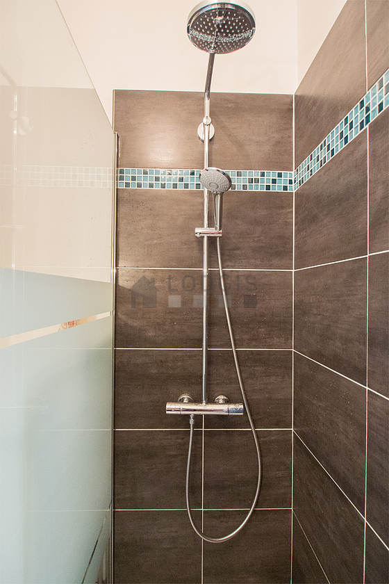 Bathroom equipped with washing machine, bath towels
