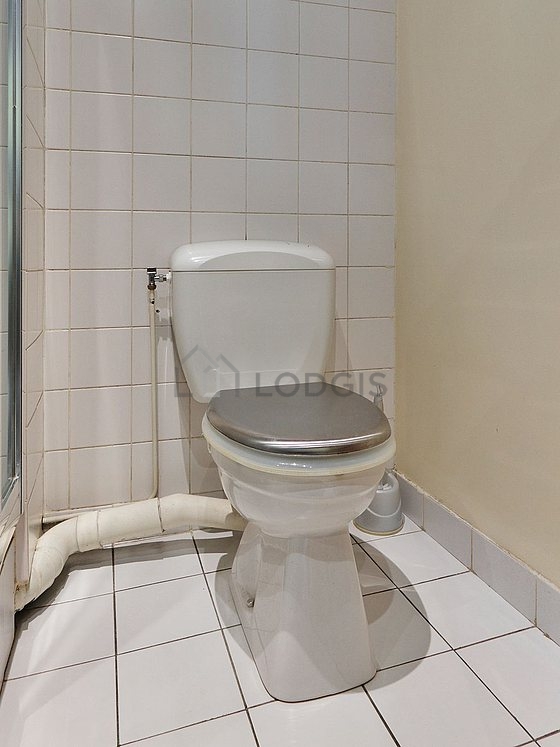 Bathroom equipped with washing machine, bath towels