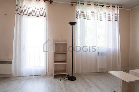 Bright living room furnished with cupboard, 3 chair(s)
