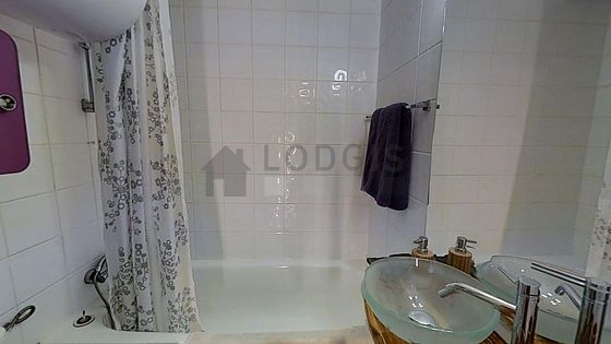 Pleasant and bright bathroom with tile floor