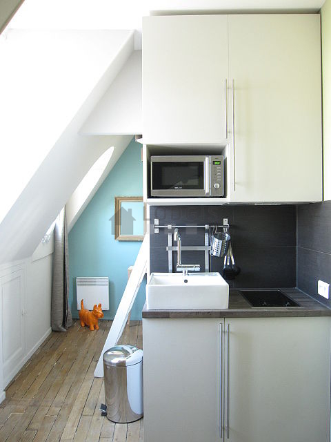 Bright kitchen with double-glazed windows facing the road
