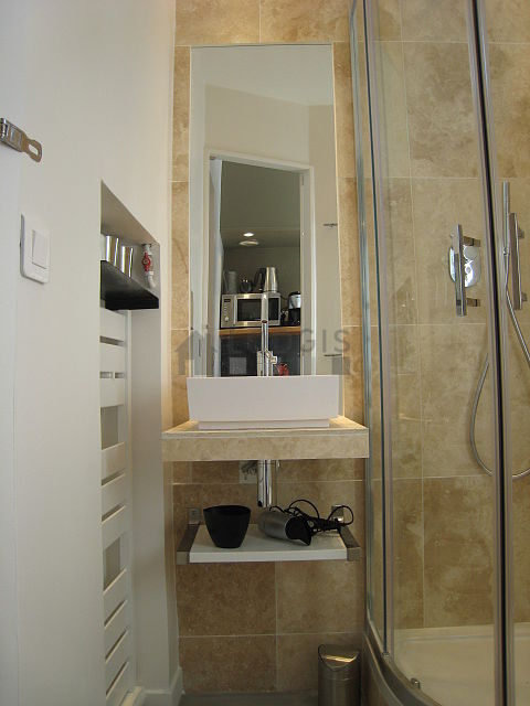 Bright bathroom with windows and with concrete floor