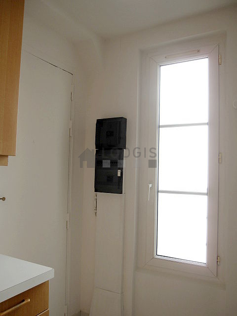 Bright kitchen with double-glazed windows facing the courtyard
