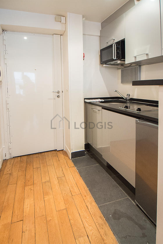 Kitchen equipped with washing machine, refrigerator, freezer, crockery