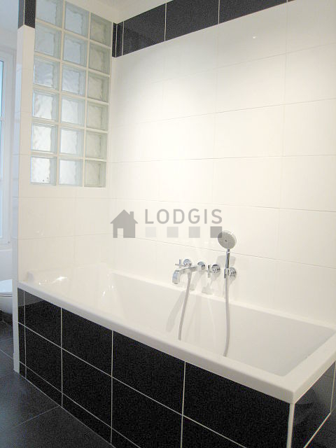 Bathroom equipped with washing machine, bath towels