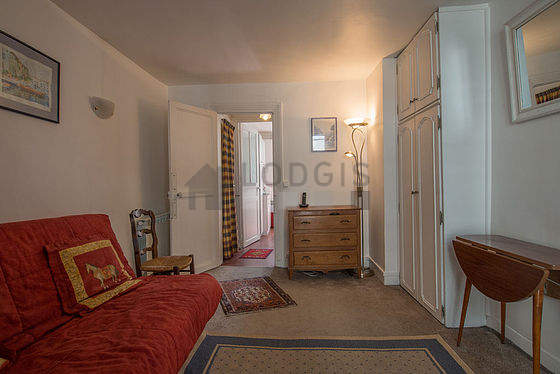 Living room with double-glazed windows facing the road