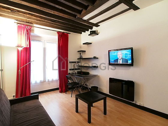 Living room with double-glazed windows facing the road