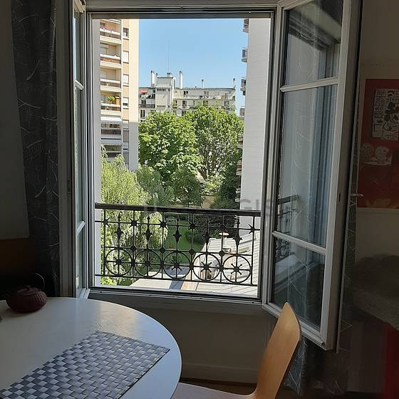 Living room with double-glazed windows facing the road