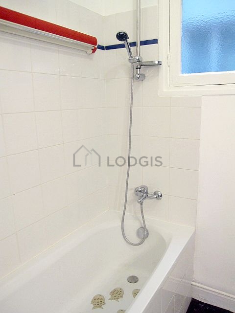 Beautiful and bright bathroom with windows and with linoleum floor