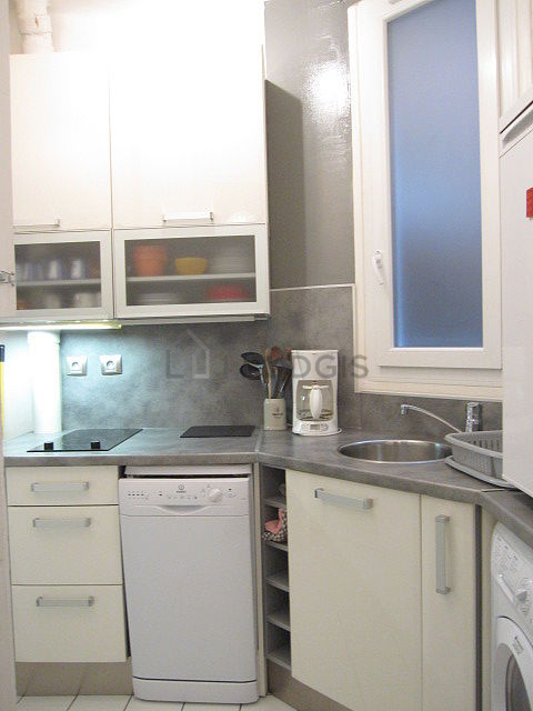Kitchen equipped with washing machine, dryer, refrigerator, freezer