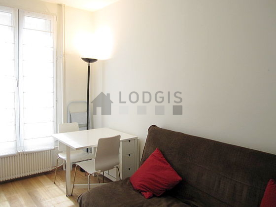 Bright living room furnished with cupboard