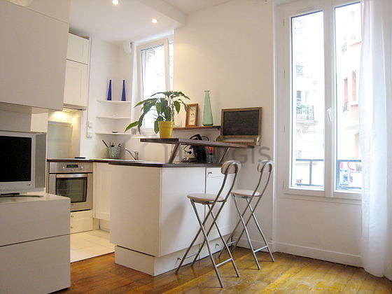 Bright kitchen with double-glazed windows facing the road