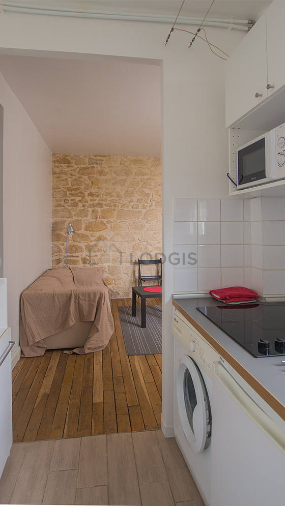 Bright kitchen with double-glazed windows facing the courtyard