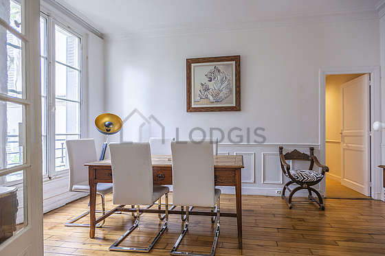 Dining room equipped with dining table, bookcase