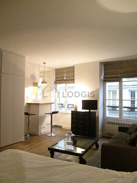 Quiet living room furnished with 1 bed(s) of 140cm, tv, wardrobe, cupboard