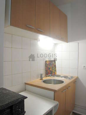 Kitchen where you can have dinner for 3 person(s) equipped with hob, refrigerator, crockery