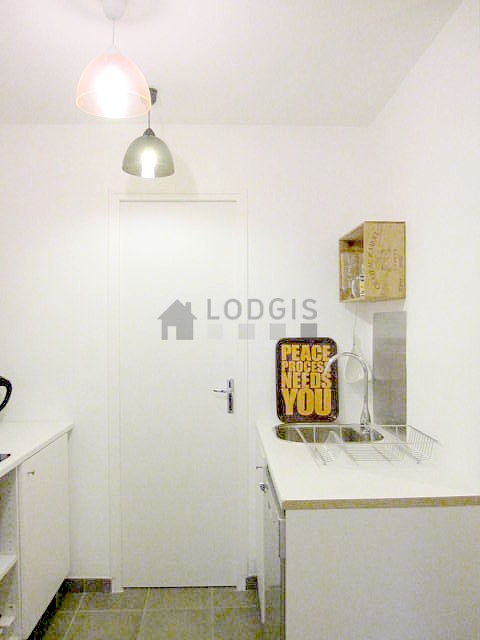 Kitchen equipped with dishwasher, hob, refrigerator, crockery