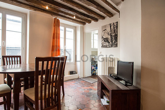 Living room with double-glazed windows facing the road