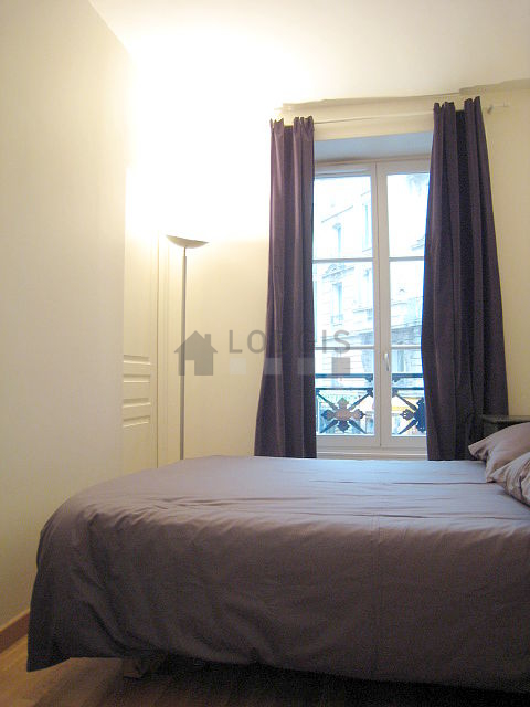 Bedroom with wooden floor