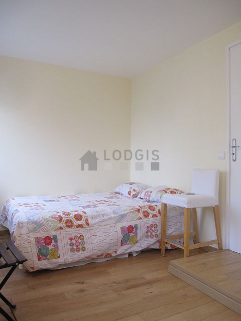Bedroom with wooden floor