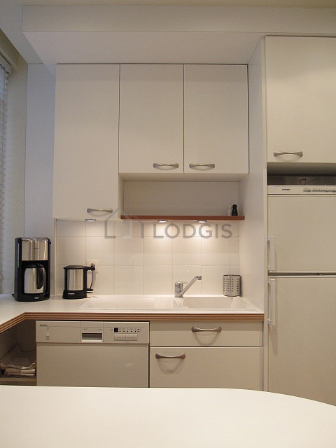 Kitchen equipped with dishwasher, hob, refrigerator, freezer