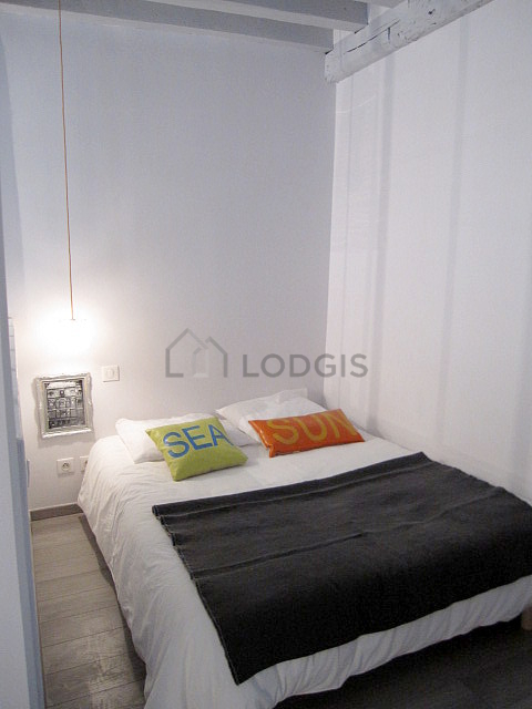 Bedroom with wooden floor