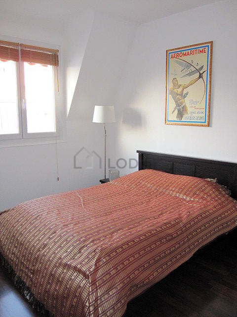 Bedroom with windows facing the road