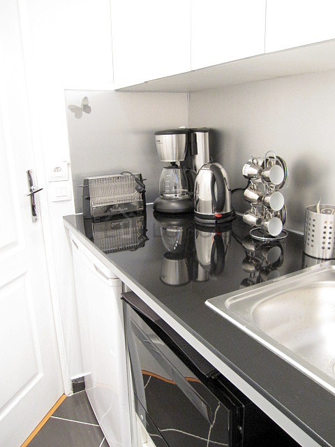 Kitchen with double-glazed windows facing the courtyard
