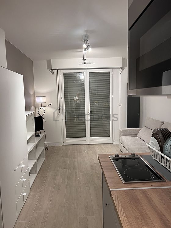 Quiet living room furnished with 1 sofabed(s) of 140cm, tv, wardrobe, cupboard