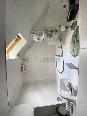 Bathroom equipped with shelves, electric toilet
