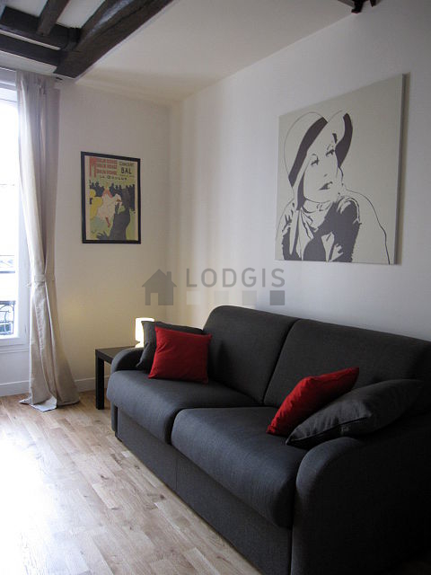 Living room with double-glazed windows facing the road